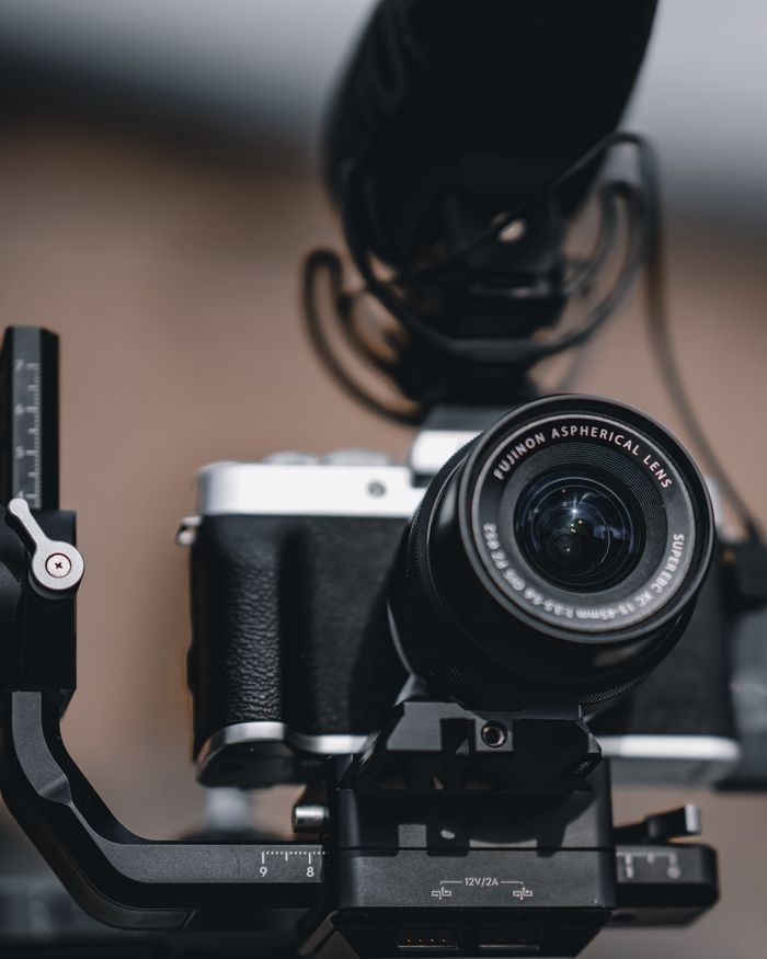 Detailed shot of a classic camera featuring a Fujinon aspherical lens on a stabilizer.